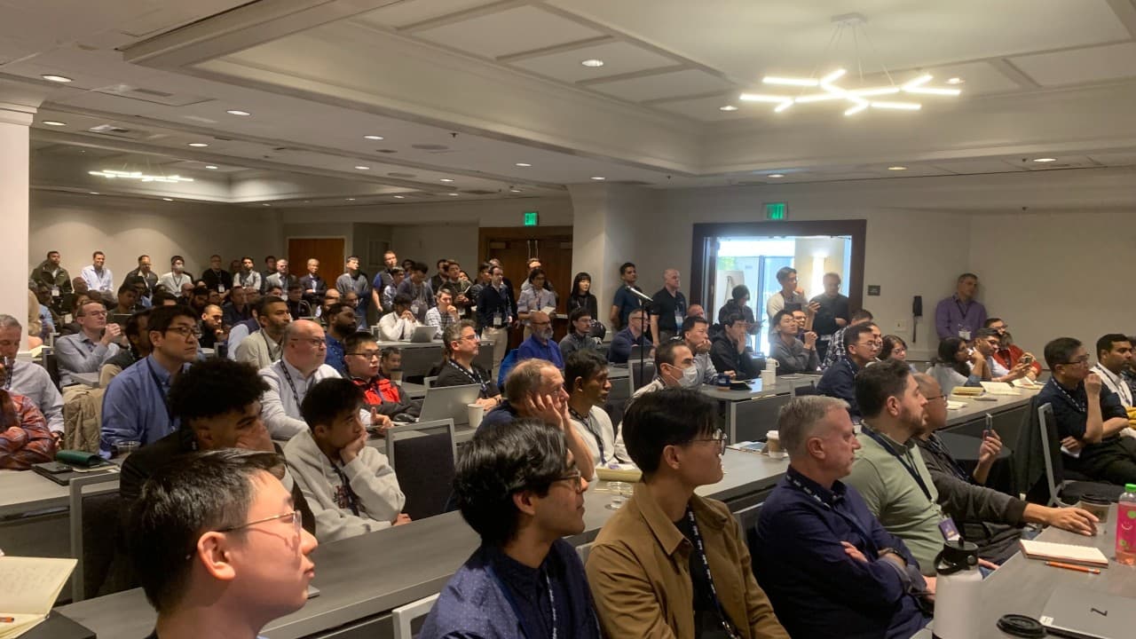 Crowded DVCon 2025 session watching ChipAgents presentation